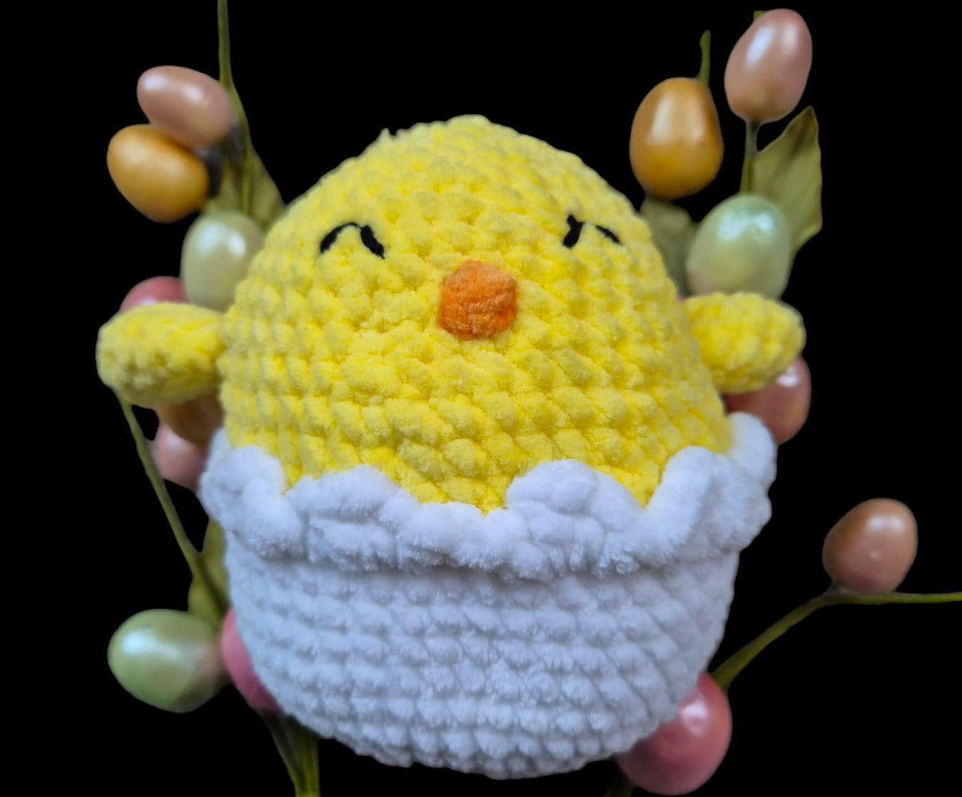 An easter chick in a cracked egg shell soft toy