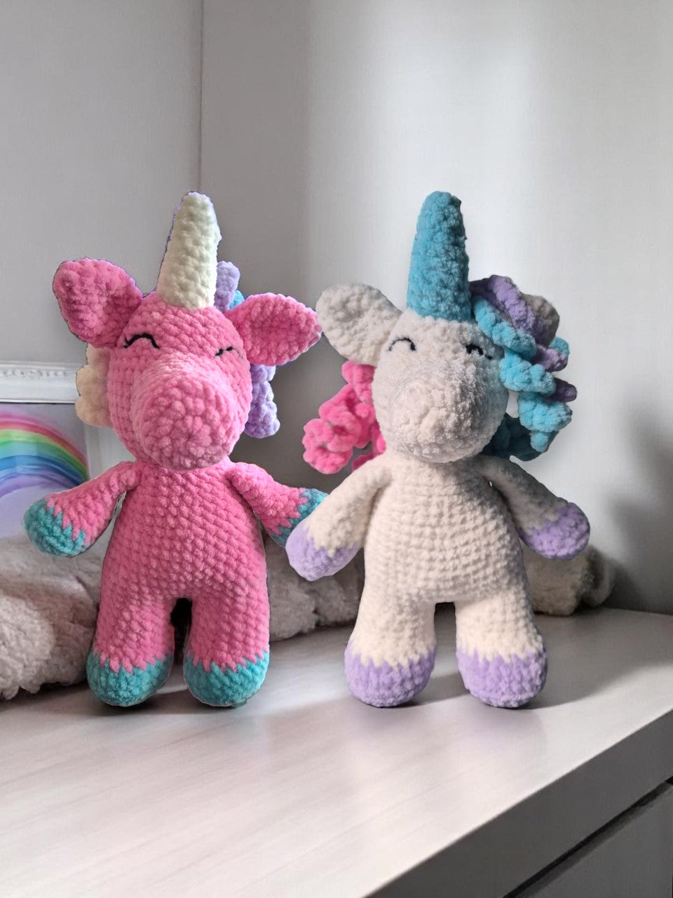 Pink and white crocheted unicorn soft toys
